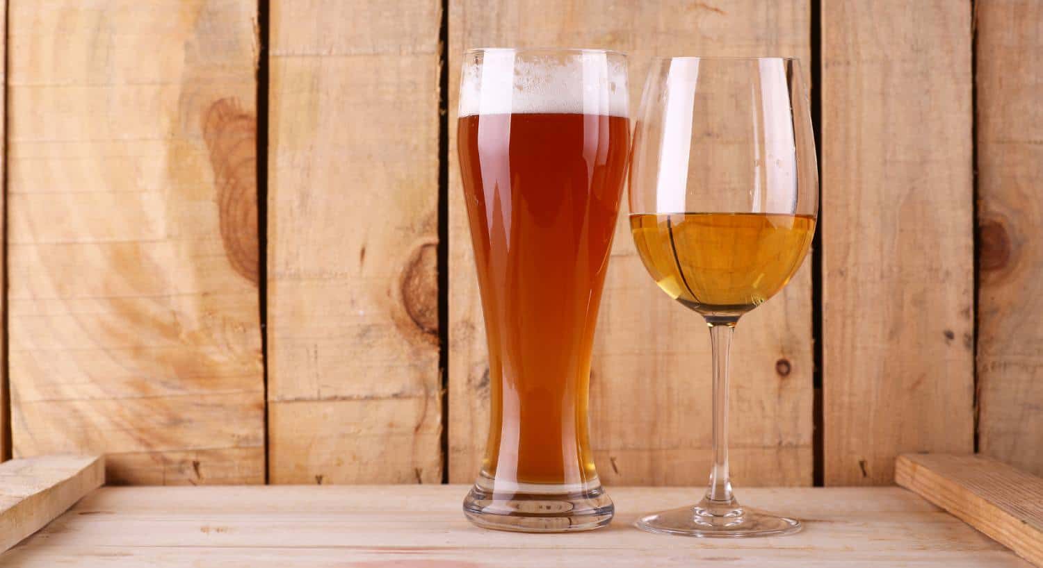 Close up view of beer in a stein glass and wine in wine glass