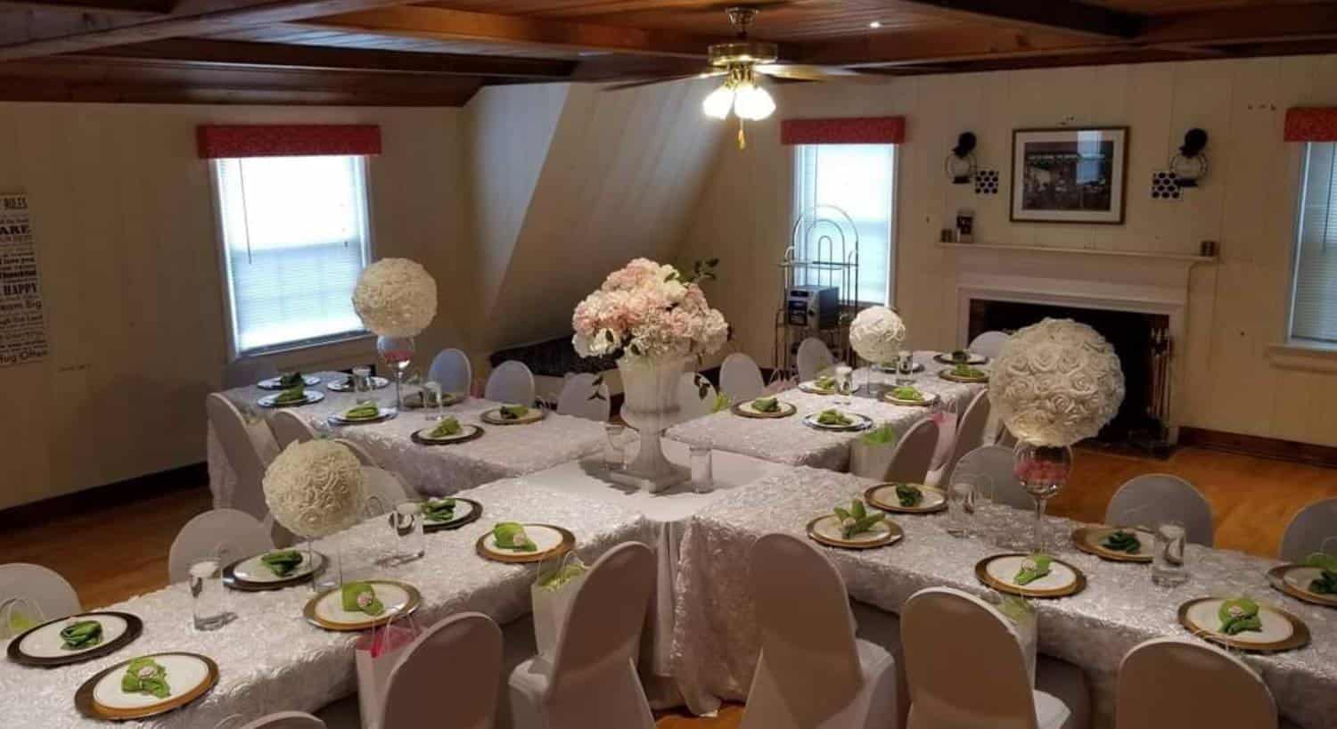 Morehead Manor event space arranged with formal table settings