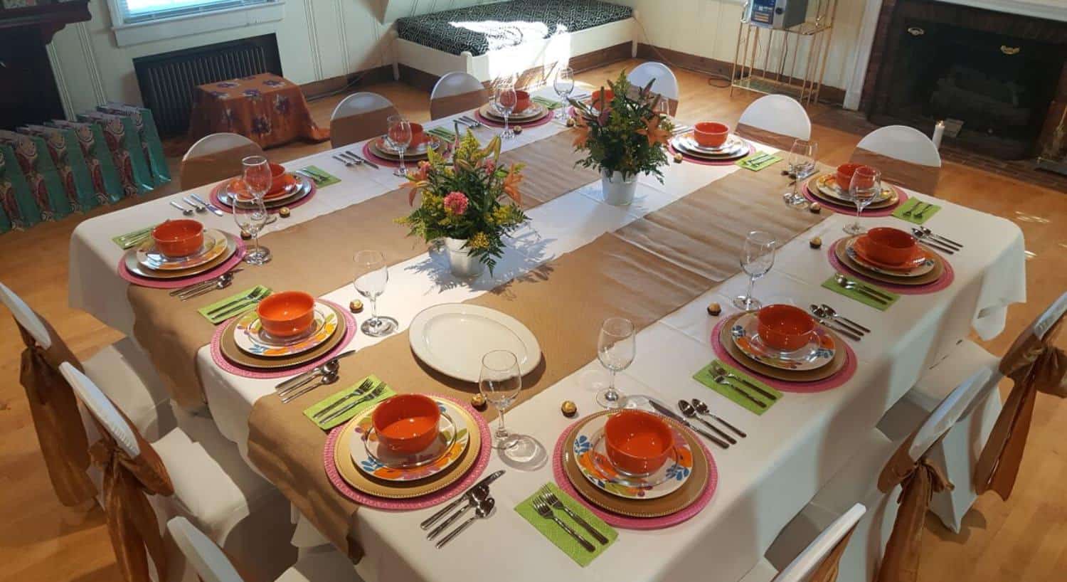 Dining room table set for an event at Morehead Manor